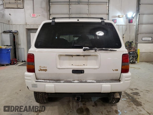 1997 Jeep Grand Cherokee Limited with VIN 1J4GZ78Y5VC747553, listed as a Copart auction lot 49125085 with 0 mi miles and Salvage Title. Bid and sale history available at carsss.com. Image 6.
