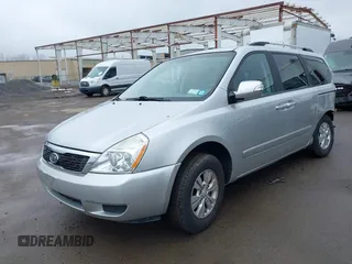 2012 Kia Sedona LX with VIN KNDMG4C72C6485952, listed as a IAAI auction lot 42029147 with 129,296 mi miles. Bid and sale history available at carsss.com. Image 2.