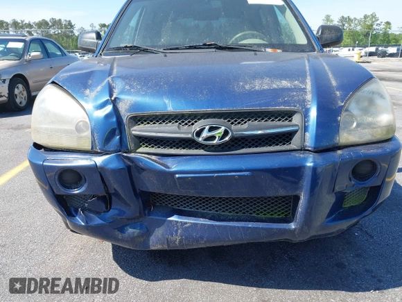 2005 Hyundai Tucson GL with VIN KM8JM12B85U233228, listed as a IAAI auction lot 42051627 with 170,742 mi miles. Bid and sale history available at carsss.com. Image 6.