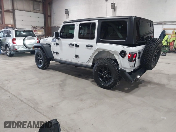 2023 Jeep Wrangler Sport S with VIN 1C4HJXDN2PW632584, listed as a IAAI auction lot 41965191 with 20,288 mi miles and . Bid and sale history available at DreamBid. Image 3.