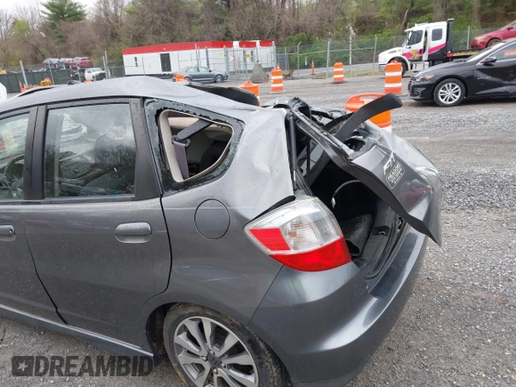 2013 Honda Fit Sport with VIN JHMGE8H56DC029276, listed as a IAAI auction lot 42002632 with 199,549 mi miles. Bid and sale history available at carsss.com. Image 20.