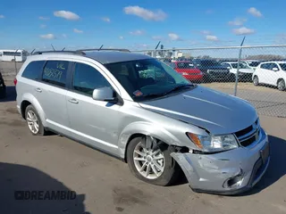 2013 Dodge Journey SXT with VIN 3C4PDDBG4DT506900, listed as a IAAI auction lot 42032379 with 130,911 mi miles and . Bid and sale history available at DreamBid. Image 1.
