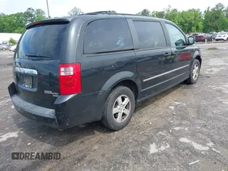 2010 Dodge Grand Caravan SXT with VIN 2D4RN5D11AR459864, listed as a IAAI auction lot 42197818 with 149,553 mi miles and . Bid and sale history available at DreamBid. Image 4.
