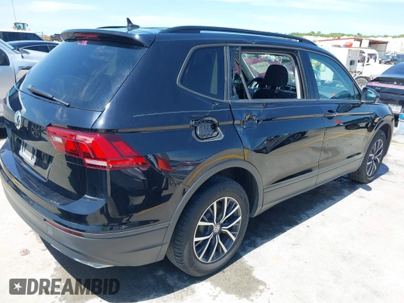 2021 Volkswagen Tiguan S with VIN 3VV1B7AX9MM067347, listed as a IAAI auction lot 42305101 with 77,042 mi miles and . Bid and sale history available at DreamBid. Image 4.
