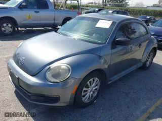 2012 Volkswagen Beetle Entry PZEV with VIN 3VWFP7ATXCM645079, listed as a IAAI auction lot 41593451 with 133,377 mi miles. Bid and sale history available at carsss.com. Image 2.
