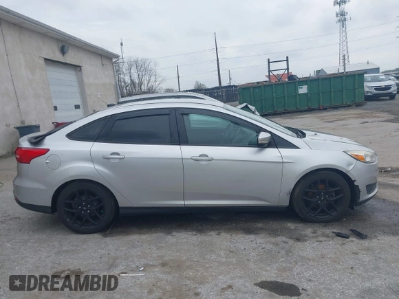 2015 Ford Focus SE with VIN 1FADP3F29FL258781, listed as a IAAI auction lot 41963223 with 121,286 mi miles and . Bid and sale history available at DreamBid. Image 13.