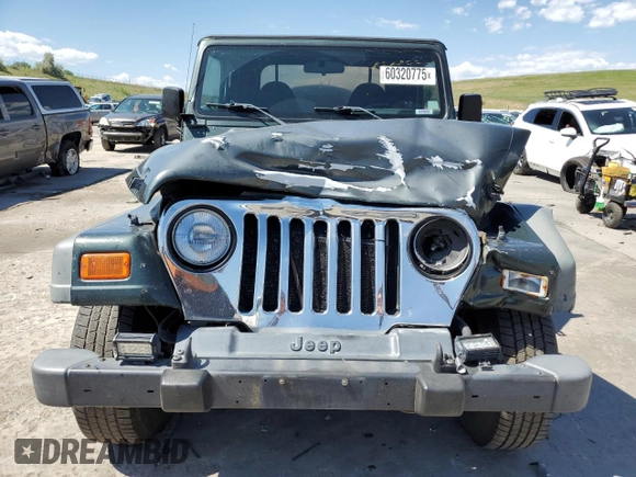 2002 Jeep Wrangler Sport с VIN 1J4FA49SX2P738105, выставлен на аукционе Copart как лот 60320775 с пробегом 402 518 миль миль и Списание • Salvage title. История ставок и продаж доступна на DreamBid. Изображение 5.