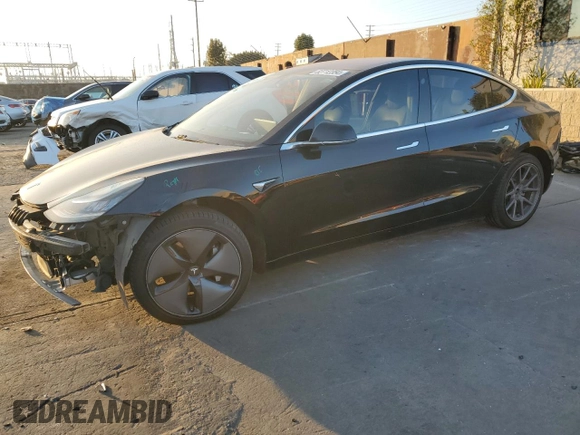 2019 Tesla Model 3 Mid Range z VIN 5YJ3E1EA8KF306096, wystawiony jako Copart lot #82712354 z przebiegiem 170 775 mil mil oraz Szkoda całkowita • Salvage title. Historia ofert i sprzedaży dostępna na DreamBid. Obrazek 1.