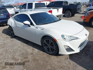 2015 Scion FR-S with VIN JF1ZNAA13F8707454, listed as a IAAI auction lot 41239233 with 130,126 mi miles. Bid and sale history available at carsss.com. Image 1.