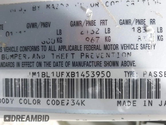 2011 Mazda Mazda3 i Sport with VIN JM1BL1UFXB1453950, listed as a IAAI auction lot 42180303 with 228,154 mi miles. Bid and sale history available at carsss.com. Image 9.