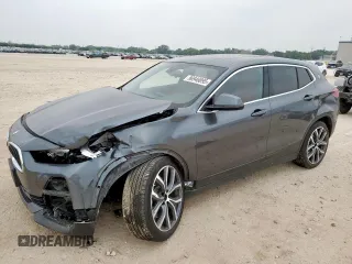 2022 BMW X2 sDrive28i with VIN WBXYH9C03N5U46359, listed as a Copart auction lot 56946095 with 19,672 mi miles and Salvage title. Bid and sale history available at DreamBid. Image 1.