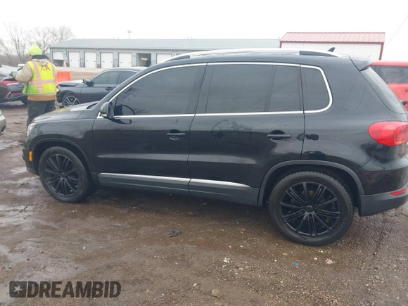 2012 Volkswagen Tiguan SE with VIN WVGAV7AX0CW602713, listed as a IAAI auction lot 41558520 with 95,678 mi miles and . Bid and sale history available at DreamBid. Image 14.
