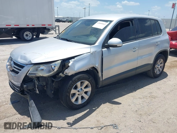 2010 Volkswagen Tiguan S with VIN WVGAV7AX5AW002380, listed as a IAAI auction lot 42604662 with 124,841 mi miles and . Bid and sale history available at DreamBid. Image 2.