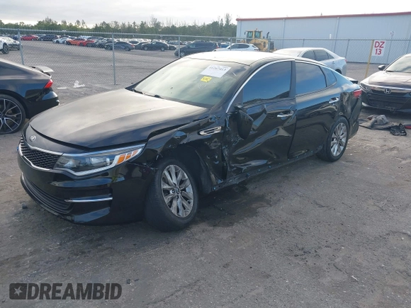 2018 Kia Optima LX with VIN 5XXGT4L38JG256924, listed as a IAAI auction lot 41267413 with 129,820 mi miles and . Bid and sale history available at DreamBid. Image 2.