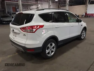 2014 Ford Escape SE with VIN 1FMCU9G90EUD81774, listed as a IAAI auction lot 42067148 with 115,277 mi miles. Bid and sale history available at carsss.com. Image 4.