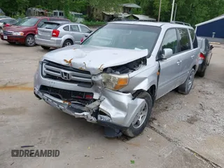 2007 Honda Pilot EX-L z VIN 5FNYF18527B011200, wystawiony jako IAAI lot #42299392 z przebiegiem 86 523 mil mil oraz . Historia ofert i sprzedaży dostępna na DreamBid. Obrazek 1.
