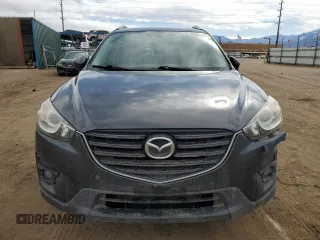 2016 Mazda CX-5 Grand Touring z VIN JM3KE4DY0G0633861, wystawiony jako Copart lot #47748645 z przebiegiem 112 219 mil mil oraz Szkoda całkowita • Salvage title. Historia ofert i sprzedaży dostępna na DreamBid. Obrazek 5.