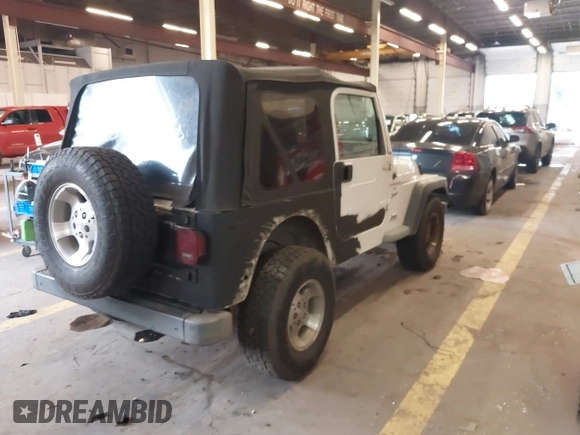 1999 Jeep Wrangler Sport with VIN 1J4FY19S6XP449014, listed as a IAAI auction lot 41893297 with 181,114 mi miles. Bid and sale history available at carsss.com. Image 4.