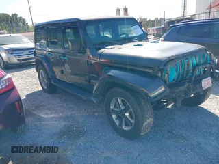 2018 Jeep Wrangler Unlimited Sahara z VIN 1C4HJXEN5JW261250, wystawiony jako IAAI lot #42008730 z przebiegiem 113 330 mil mil oraz . Historia ofert i sprzedaży dostępna na DreamBid. Obrazek 1.
