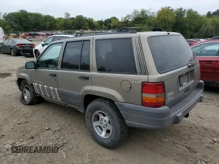 1996 Jeep Grand Cherokee Laredo with VIN 1J4GZ58S7TC403946, listed as a Copart auction lot 71785734 with 231,780 mi miles and Salvage Title. Bid and sale history available at carsss.com. Image 2.