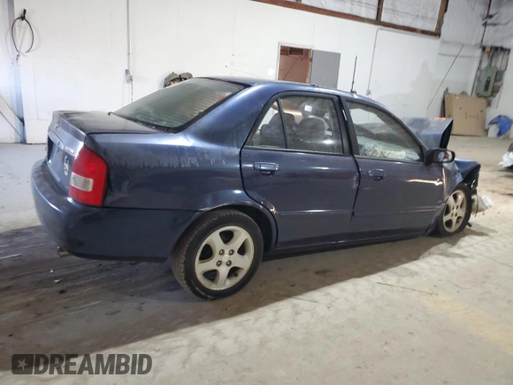 2000 Mazda Protege ES with VIN JM1BJ221XY0211385, listed as a Copart auction lot 48225605 with Not Provided miles and Non Repairable. Bid and sale history available at DreamBid. Image 3.