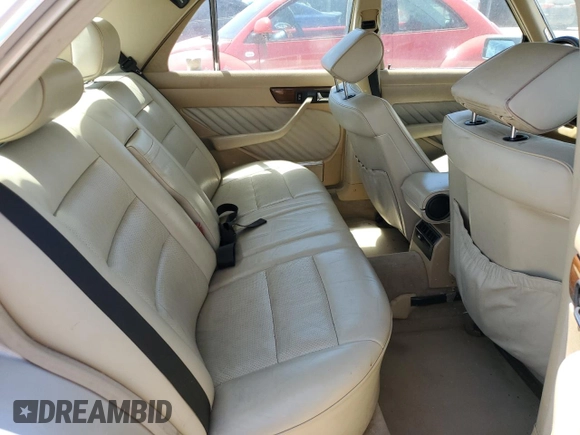 1990 Mercedes-Benz 300 with VIN WDBCA24D1LA529716, listed as a Copart auction lot 56581335 with 122,286 mi miles and Salvage Title. Bid and sale history available at DreamBid. Image 10.