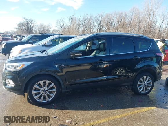2017 Ford Escape Titanium with VIN 1FMCU0J94HUD58815, listed as a IAAI auction lot 41455415 with 80,421 mi miles and . Bid and sale history available at DreamBid. Image 15.