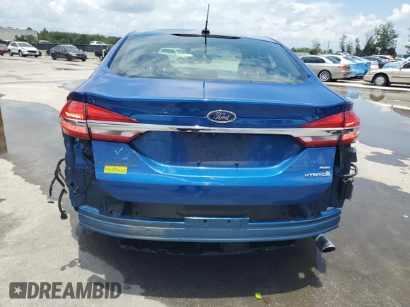 2017 Ford Fusion Hybrid SE z VIN 3FA6P0LU6HR319103, wystawiony jako Copart lot #58494695 z przebiegiem 104 483 mil mil oraz Szkoda całkowita • Salvage title. Historia ofert i sprzedaży dostępna na DreamBid. Obrazek 6.