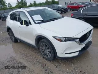 2020 Mazda CX-5 Grand Touring with VIN JM3KFBDM4L1847772, listed as a IAAI auction lot 42265349 with 85,007 mi miles and . Bid and sale history available at DreamBid. Image 1.