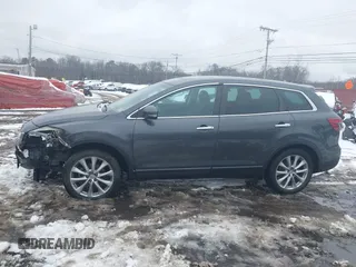 2014 Mazda CX-9 Grand Touring with VIN JM3TB3DV9E0440506, listed as a IAAI auction lot 41537718 with 217,299 mi miles and . Bid and sale history available at DreamBid. Image 14.