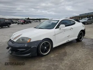 2003 Hyundai Tiburon z VIN KMHHM65D53U042971, wystawiony jako Copart lot #86919434 z przebiegiem 202 250 mil mil oraz Szkoda całkowita • Salvage title. Historia ofert i sprzedaży dostępna na DreamBid. Obrazek 1.