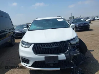2021 Chrysler Pacifica Touring with VIN 2C4RC1FG7MR605587, listed as a IAAI auction lot 42329028 with 111,305 mi miles and . Bid and sale history available at DreamBid. Image 12.