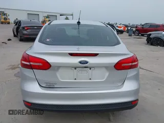 2017 Ford Focus S z VIN 1FADP3E28HL210368, wystawiony jako IAAI lot #42260711 z przebiegiem 69 067 mil mil oraz . Historia ofert i sprzedaży dostępna na DreamBid. Obrazek 16.