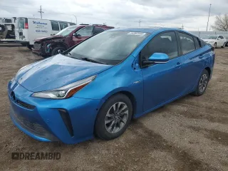 2020 Toyota Prius L Eco z VIN JTDKARFU2L3103721, wystawiony jako Copart lot #54382895 z przebiegiem 87 657 mil mil oraz Szkoda całkowita • Salvage title. Historia ofert i sprzedaży dostępna na DreamBid. Obrazek 1.