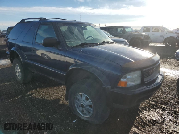 2003 GMC Jimmy z VIN 1GKCT18X13K112296, wystawiony jako Copart lot #46479275 z przebiegiem Nie podano mil oraz Czysty tytuł • Clean title. Historia ofert i sprzedaży dostępna na DreamBid. Obrazek 1.