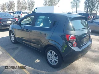 2014 Chevrolet Sonic LT with VIN 1G1JC6SG4E4118781, listed as a IAAI auction lot 41862192 with 124,375 mi miles. Bid and sale history available at carsss.com. Image 3.