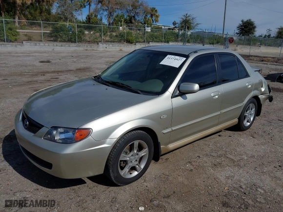 2003 Mazda Protege DX with VIN JM1BJ225731212628, listed as a IAAI auction lot 41374927 with 105,662 mi miles. Bid and sale history available at carsss.com. Image 18.