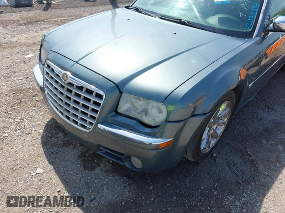 2006 Chrysler 300 C with VIN 2C3KA63H76H141246, listed as a IAAI auction lot 42035339 with 208,798 mi miles. Bid and sale history available at carsss.com. Image 6.