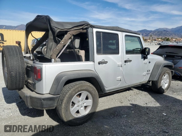 2007 Jeep Wrangler Unlimited X with VIN 1J8GB39157L142982, listed as a Copart auction lot 82050134 with 72,666 mi miles and Salvage Title. Bid and sale history available at DreamBid. Image 3.