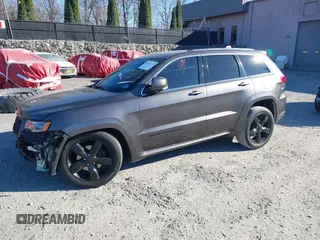 2015 Jeep Grand Cherokee Overland with VIN 1C4RJFCGXFC215750, listed as a IAAI auction lot 40795135 with 89,110 mi miles and . Bid and sale history available at DreamBid. Image 21.