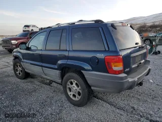 1999 Jeep Grand Cherokee Laredo with VIN 1J4GW58N6XC784679, listed as a Copart auction lot 85345304 with 234,584 mi miles and Salvage Title. Bid and sale history available at carsss.com. Image 2.