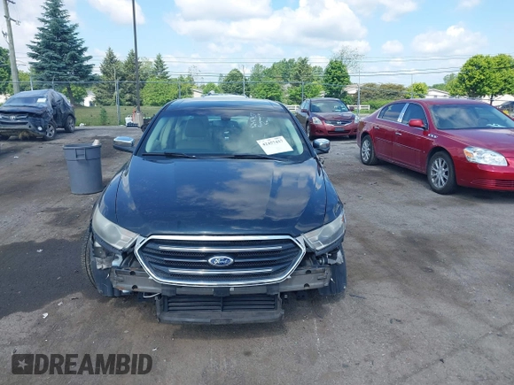 2014 Ford Taurus Limited z VIN 1FAHP2F85EG125118, wystawiony jako IAAI lot #42457437 z przebiegiem 129 406 mil mil oraz . Historia ofert i sprzedaży dostępna na DreamBid. Obrazek 12.