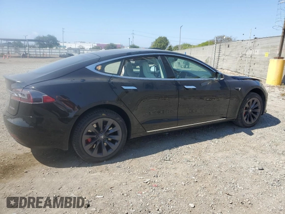 2019 Tesla Model S 100D with VIN 5YJSA1E42KF331240, listed as a Copart auction lot 54713975 with 43,940 mi miles and Salvage title. Bid and sale history available at DreamBid. Image 3.