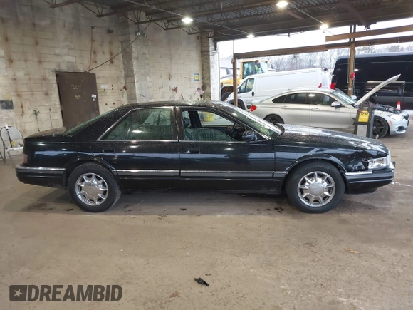 1997 Cadillac Seville Luxury SLS with VIN 1G6KS52YXVU816736, listed as a IAAI auction lot 41854220 with 107,091 mi miles. Bid and sale history available at carsss.com. Image 13.
