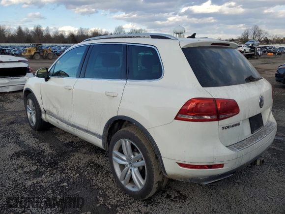 2012 Volkswagen Touareg Sport z VIN WVGFK9BP6CD002427, wystawiony jako Copart lot #42576335 z przebiegiem 167 936 mil mil oraz Szkoda całkowita • Salvage title. Historia ofert i sprzedaży dostępna na DreamBid. Obrazek 2.
