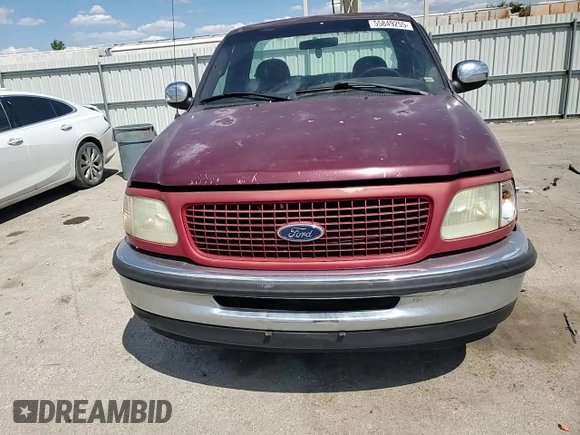 1998 Ford F-150 z VIN 1FTZF17W1WNA59477, wystawiony jako Copart lot #55849255 z przebiegiem 107 471 mil mil oraz Szkoda całkowita • Salvage title. Historia ofert i sprzedaży dostępna na DreamBid. Obrazek 13.