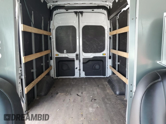 2021 Ford Transit Cargo с VIN 1FTBR1X89MKA53998, выставлен на аукционе Copart как лот 59292575 с пробегом 85 472 миль миль и Списание • Salvage title. История ставок и продаж доступна на DreamBid. Изображение 10.