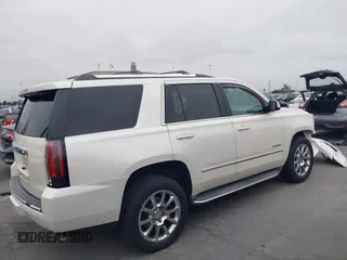 2015 GMC Yukon Denali with VIN 1GKS2CKJ9FR294551, listed as a IAAI auction lot 42162654 with 106,063 mi miles. Bid and sale history available at carsss.com. Image 14.