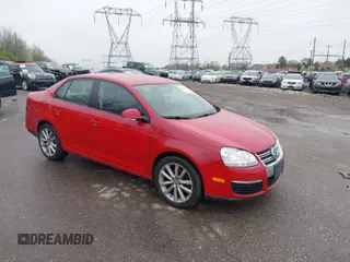 2009 Volkswagen Jetta S z VIN 3VWJM71K69M09137X, wystawiony jako IAAI lot #41982852 z przebiegiem 147 684 mil mil oraz . Historia ofert i sprzedaży dostępna na DreamBid. Obrazek 1.