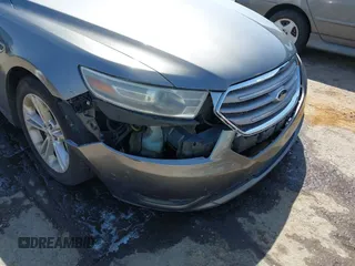 2013 Ford Taurus SEL with VIN 1FAHP2E81DG113242, listed as a IAAI auction lot 41952486 with 169,369 mi miles. Bid and sale history available at carsss.com. Image 6.